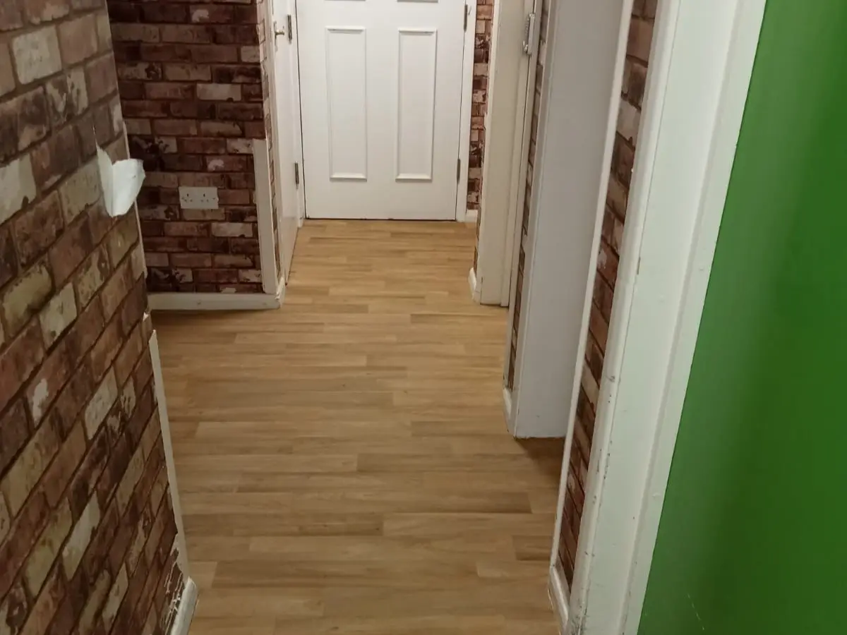 Snapshot capturing safety flooring in a nursing home, featuring a textured, anti-slip surface to prioritize the well-being of residents. Strategically placed in a communal space, the flooring offers stability and peace of mind, promoting confidence and independence among elderly inhabitants.