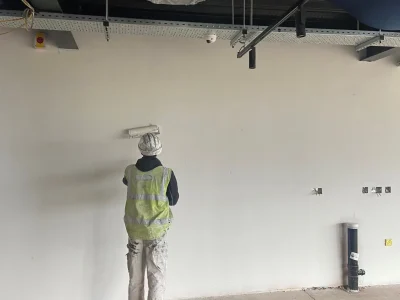 Our commercial painter and decorator Ryan hard at work painting an internal wall at Gemstone Project