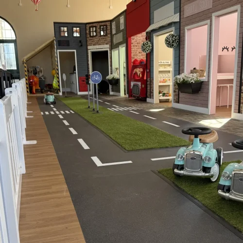 Childrens play village flooring installation in Belper with cobbled vinyl streets and shop areas